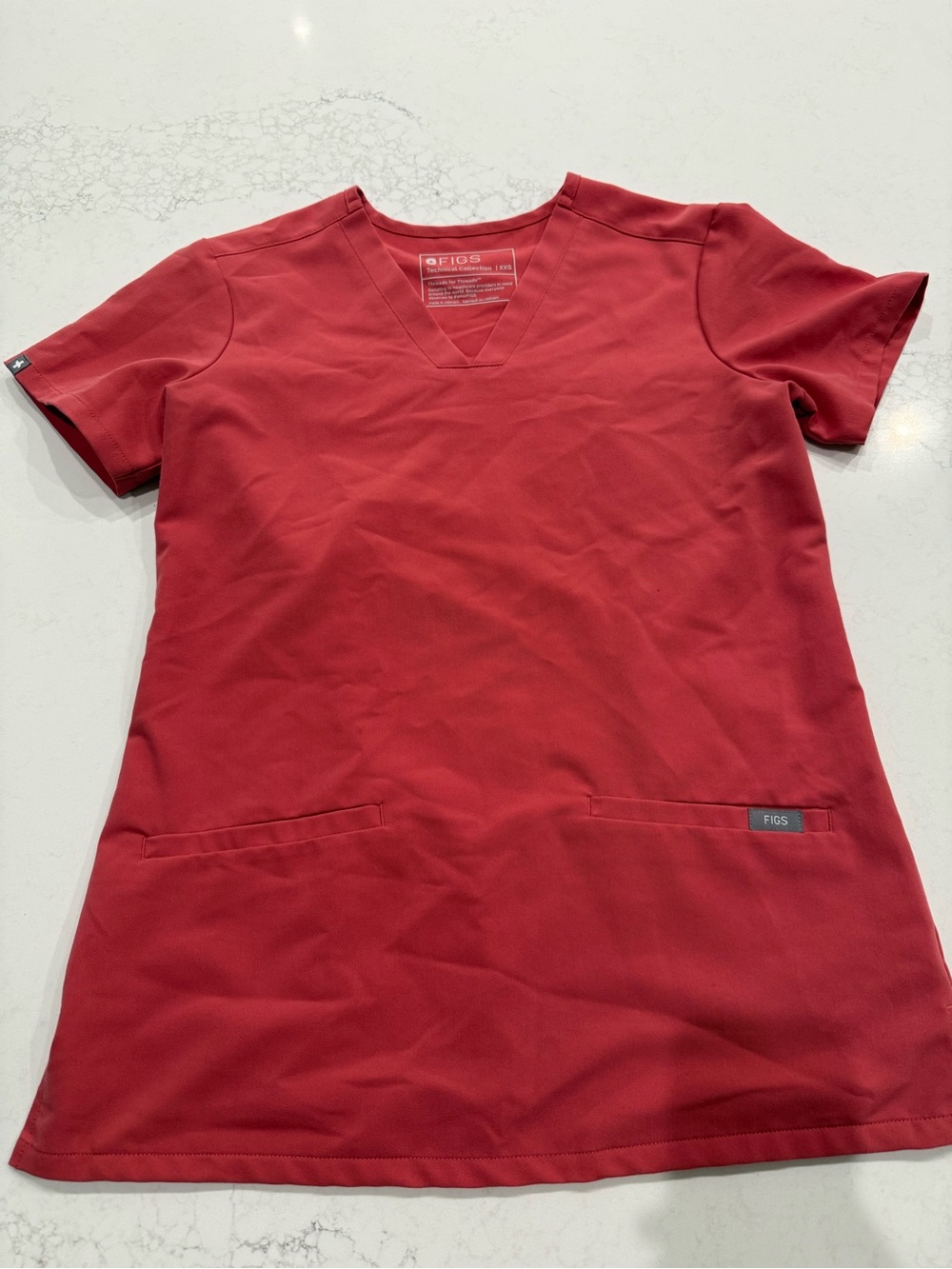 Red V-neck medical scrub top